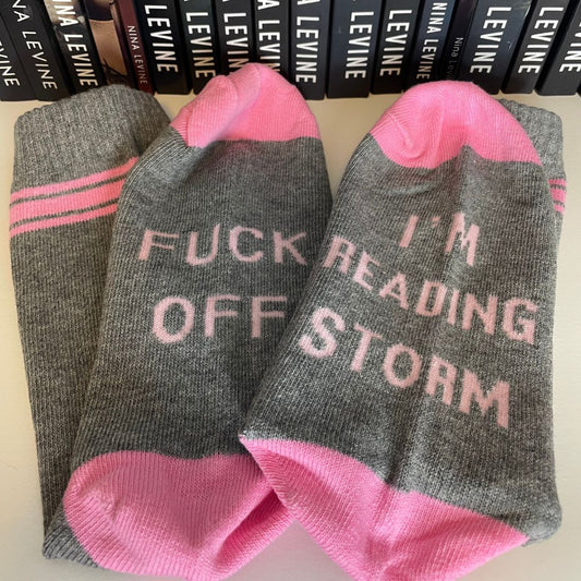 Storm MC socks from Nina Levine, Fuck Off I'm Reading Storm, pink & grey